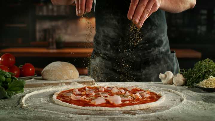 This Best-Selling Pizza Chain Uses Fresh Dough, But Frozen Toppings