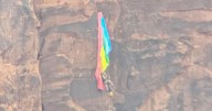 BASE jumper rescued after crashing into cliff and dangling from parachute in Utah