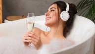 Wife Settles Into Hot Bubble Bath To Relax With A Glass Of Wine And A Podcast About A Horrific Serial Killer