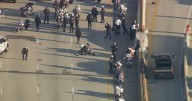 2 police officers fall off motorcycles on I-95 in Philadelphia during motorcade to food charity event