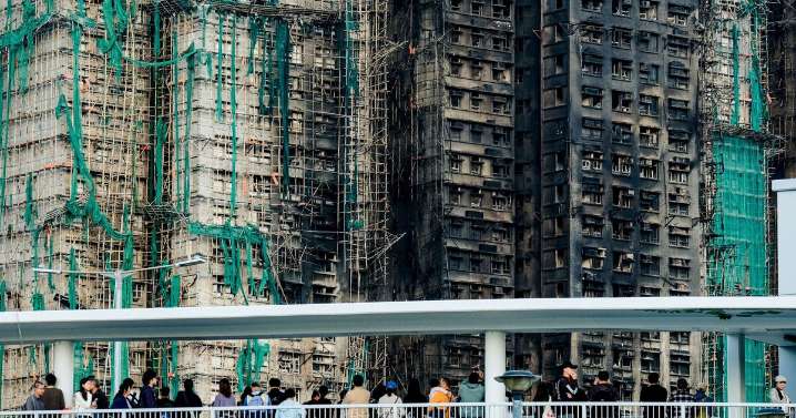 Hong Kong mourns 128 killed as fire sparks safety crackdown 