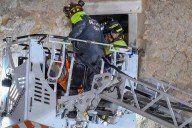 Hopes dashed as man extracted from partially collapsed medieval tower in Rome dies soon after