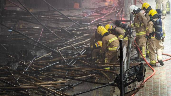 At least 36 dead and others trapped as fire continues to burn through Hong Kong tower blocks