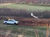 PHOTOS: Plane runs off runway at Waterbury
