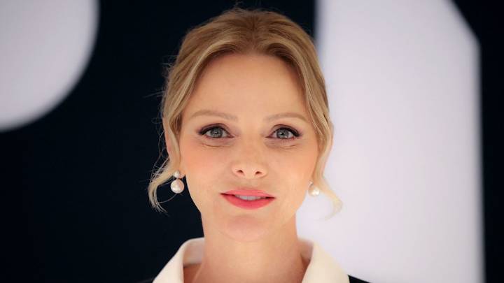 Princess Charlene puts dramatic spin on pinstripes in unusual semi