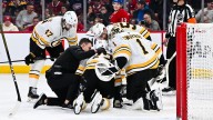 Bruins' McAvoy, hit by puck, has surgery for facial injuries