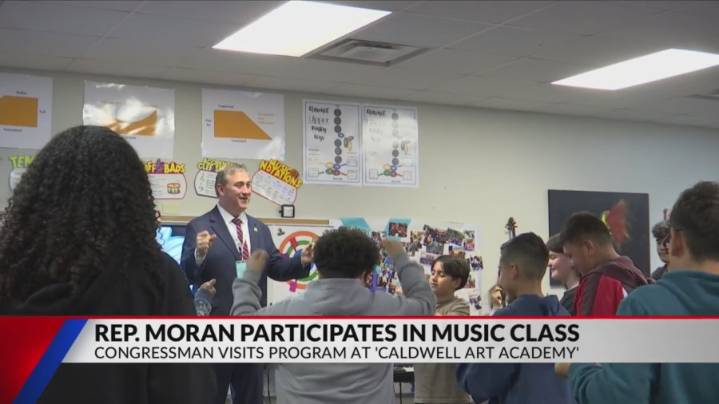 Rep. Nathaniel Moran takes part in music class at Caldwell Art Academy