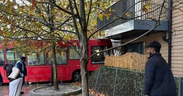 'Shock' as bus crashes into Feltham block of flats
