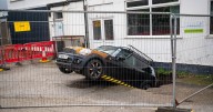 Officials yet to remove car swallowed up by random sinkhole