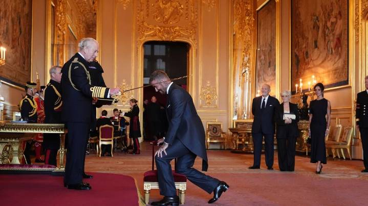 Bend a knee like Beckham: Soccer star is knighted by King Charles III