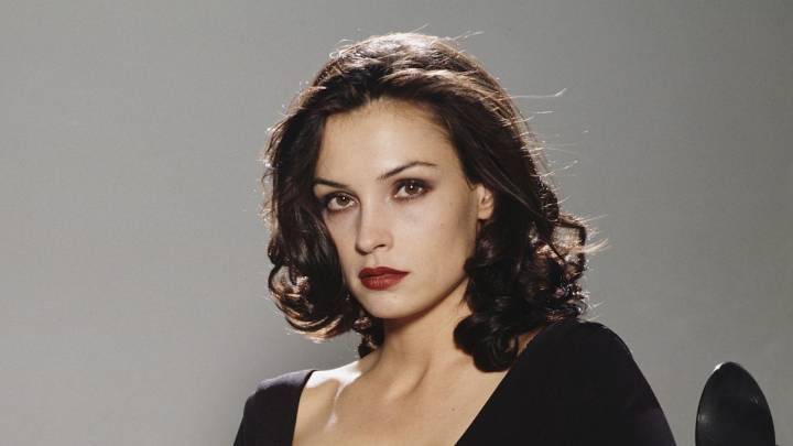 Bond girl, 61, looks like a goddess in daringly low-cut seafoam green dress with sheer tulle skirt