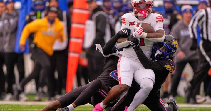 No. 14 Utah rallies to beat Kansas 31-21 and keep its slim Big 12 championship hopes alive