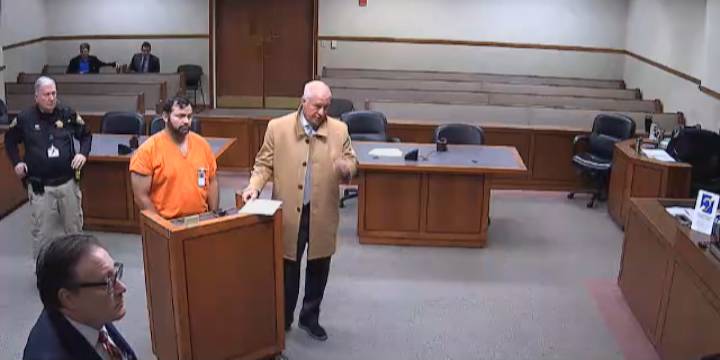 Texas man indicted for threatening University of Louisville football coach turns himself in