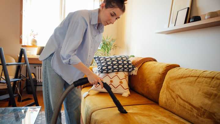 Are You Vacuuming Your Couch Enough? Here's How Often You Really Should