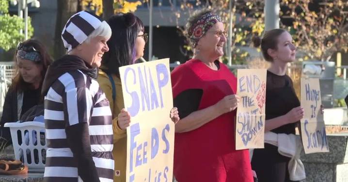 Costumed protesters denounce potential SNAP freeze on Halloween
