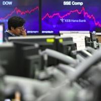 Asian markets tumble as tech bubble fears grow