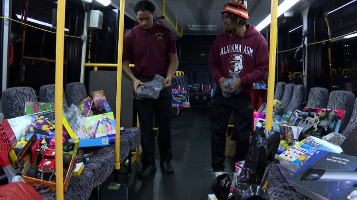 Alabama A&M students stuff a bus full of Christmas presents