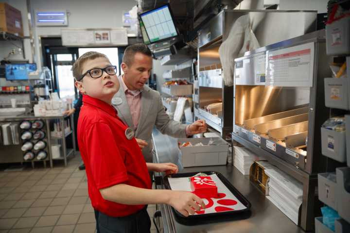 Chick-fil-A got Aidden Tilly through his wait for a new heart. Now, he's serving others at the restaurant
