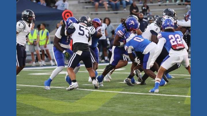 'He keeps me pushing' Father-son duo bond over football, family, and military life