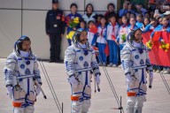 Chinese astronauts return from space station after delay blamed on space debris damage