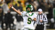 Oregon saves CFP hopes, escapes Iowa on last