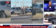 Witness video shows officers with guns drawn at busy Lincoln intersection