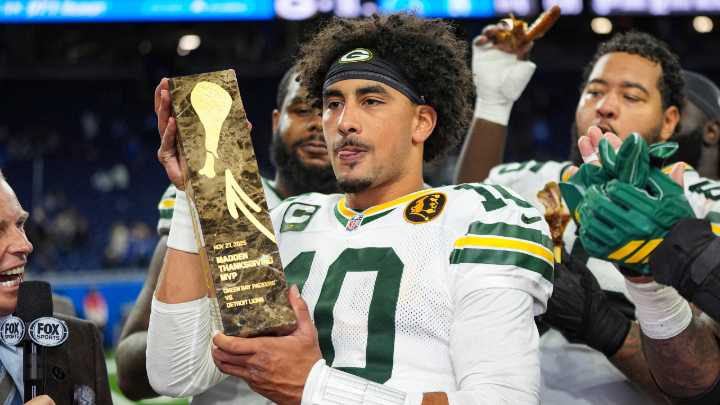 Love matches career high with four TD passes, lifting Packers to win over Lions