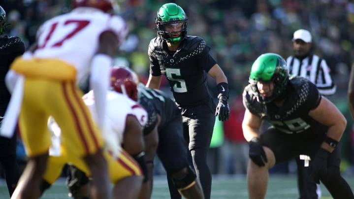 Moore throws 2 TD passes and No. 6 Oregon derails No. 16 USC's CFP hopes with a 42