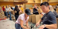 Volunteers help build Thanksgiving food boxes for Portland families