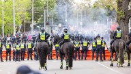 Melbourne protests: Police hunt eight protesters after rock, bottle attacks put officers in hospital