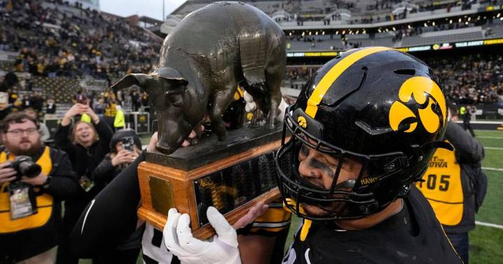 Meet the rivalry trophies of college football