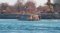 Eyes glued on a small houseboat that navigated the St. Clair River