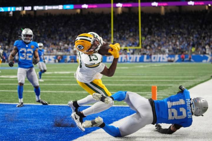 Love matches career high with 4 TD passes, lifting Packers to 31