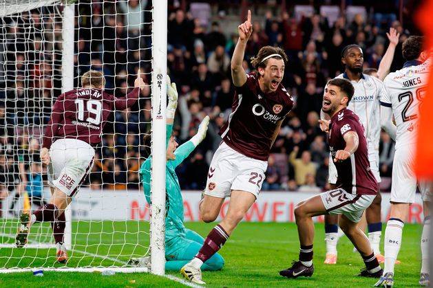 Hearts storm to victory over Dundee as they move clear of Celtic in Scottish Premiership title race