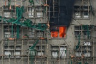 Hong Kong apartment death toll soars as city investigates fire cause