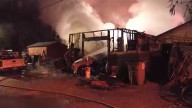 Firefighters extinguish flames at Evansville garage overnight