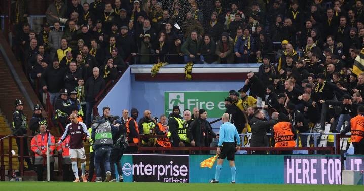 Aston Villa Europa League tie halted as away fans throw seats and drinks at police in violent scenes