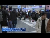 Winter storm impacting  busy holiday travel day in Chicago