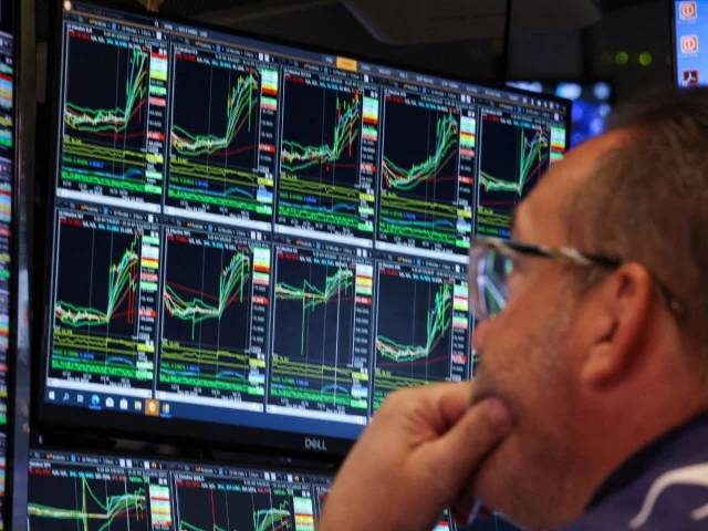 Asian markets climb despite pressure from strong US dollar