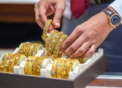 Gold rebounds from one-week low as dollar index slips