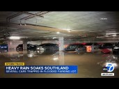 Several cars trapped in flooding parking garage