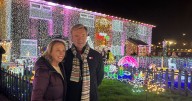 Torvill and Dean switch on Nuthall family's last Christmas lights display