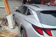 Car crashed into Everett home, injuring two Monday