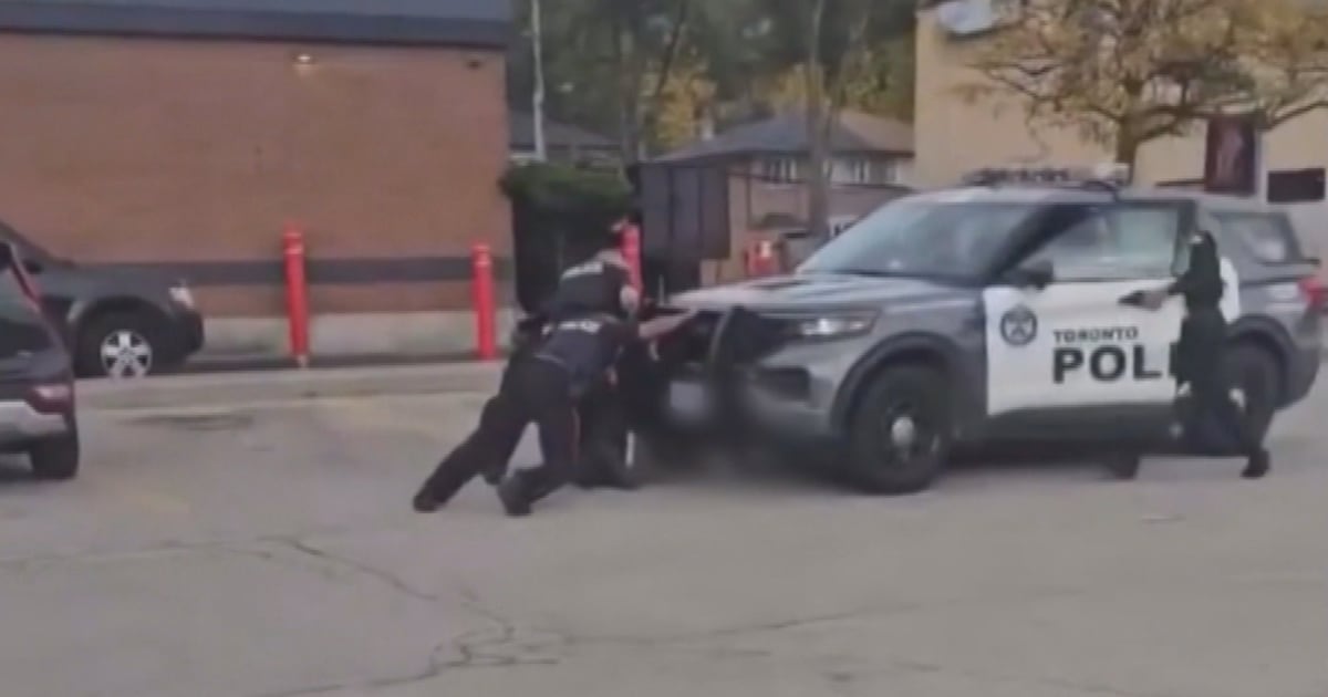 Toronto police car accidentally runs over suspect, officer