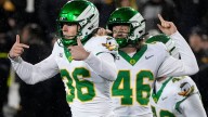 Oregon saves CFP hopes, escapes Iowa on last