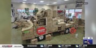 Oshkosh West U-Haul employees build ‘U-Haul-o-saurus Truck’ for Halloween