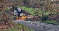 Gritter lorry pictured on its roof as road remains closed hours later