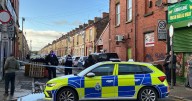 Armed police cordon off street