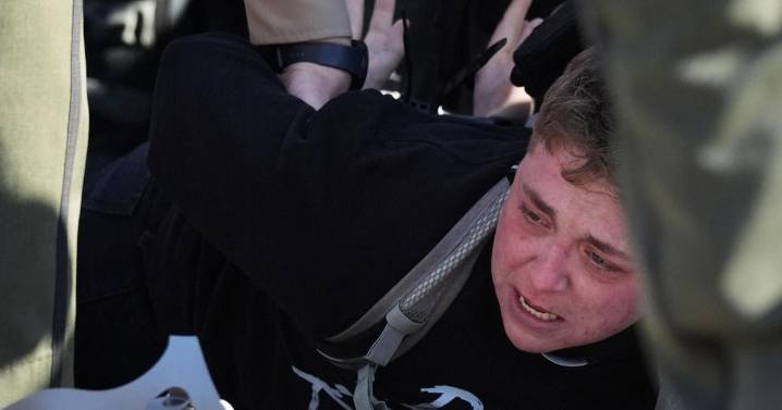 Protesters arrested, officers injured in clash outside Chicago