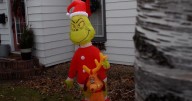Osseo police pitch in to help family after teens steal Grinch inflatable from their yard